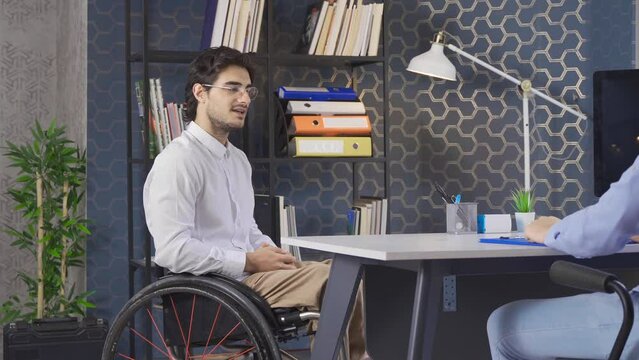 Job applicant disabled man.
Disabled businessman office worker wants to work in the office with teamwork.
