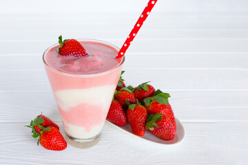 Strawberry yogurt fruit juice smoothie pink colorful fruit juice milkshake blend beverage healthy high protein the taste yummy In glass drink episode morning on white wood background.