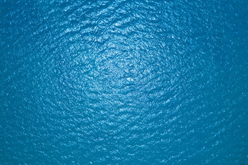 Naklejka na ściany i meble Sea surface aerial view,Bird eye view photo of blue waves and water surface texture, Blue sea background Beautiful nature, Amazing view sea background