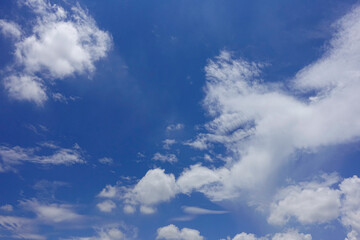 Obraz premium Puffy fluffy white clouds blue sky.