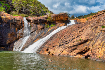 Fototapeta na wymiar Serpentine Falls is one of Perth’s best waterfalls and is stunning, with ancient landforms, woodlands, and the Serpentine River valley gorge crossing through it.