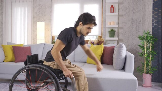 Disabled person sitting in wheelchair and thinking about life, depression.
Disabled mature man sitting in wheelchair and in living room at home.
