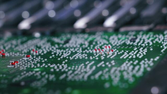 Close up of SFD surface-mount device working on PCB printed circuit board. Assembling. Modern technology. Horizontal shot . High quality 4k footage