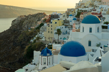 Famous blue domes of Santorini at sunset