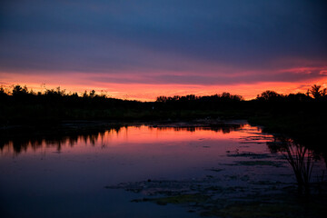 Fototapeta na wymiar colorful sunset over the pond