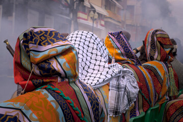 Fototapeta na wymiar Moros i cristians. Palestinian handkerchief in Ibi Moorish and Christian festivals, comparsa Chumberos. Kufiyya, kefia, ghutrah, mashadah