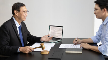 Fototapeta na wymiar Attorney or judge provides legal advice to the client in the courtroom, Ethics in the courts include justice and impartiality, Legal consultant, Scales of justice, Law hammer, Litigation and justice.