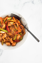 healthy plant-based food, vegan stir-fry vegetables with vermicelli noodles and satay sauce
