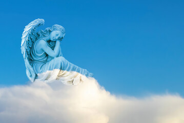 Pretty angel sleeping on a cloud