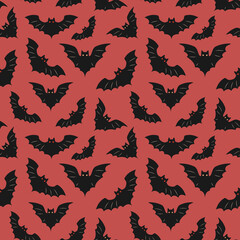 Obraz na płótnie Canvas Seamless pattern with bats on a red background
