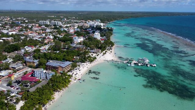 Beautiful aerial view of Boca Chica beach, its turquoise waters, resorts near the Santo Domingo Airport in Dominican Republic