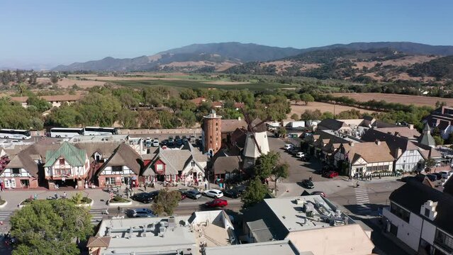 Low push-in aerial shot of a windmill in the unique Danish village of Solvang in Central California. 4K