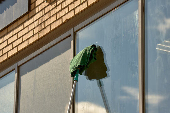 window washing, washing a street shop window