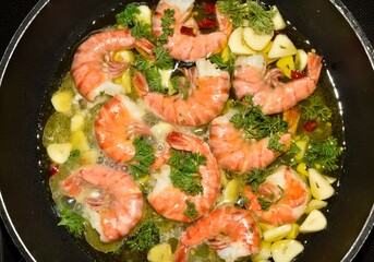 King prawns, tiger shrimps, with garlic and parsley in a pan, Canary Islands, Spain, Europe