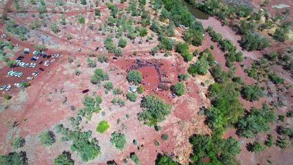 Circling aerial view of the cermony at the start of the Freedom Day Festival at Kalkaringi, Northern Territory, Australia. 26 August 2022.