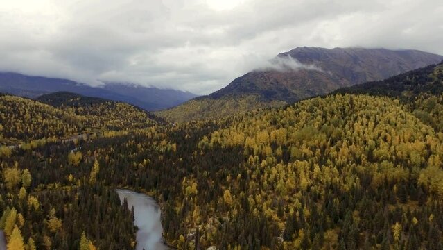 Aerial view of Alaskan landscape in fall colors with Trail River and Seward Highway