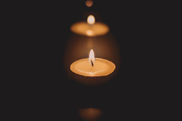 Fototapeta na wymiar candle light in the dark as light for life candle abstract background