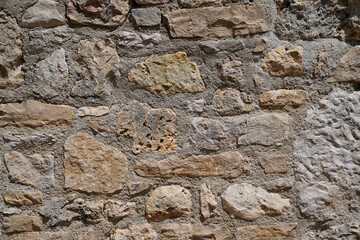 old beige wall pebble stones background