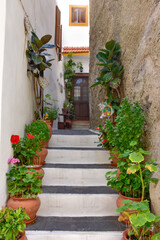 Fototapeta na wymiar White houses with blue shutters, balconies, the traditional Greek village of Mandraki on the island of Nisyros.