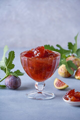 Fig jam in a glass bowl. Fruits preserve
