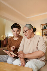 Senior Woman Asking Grandson to Help