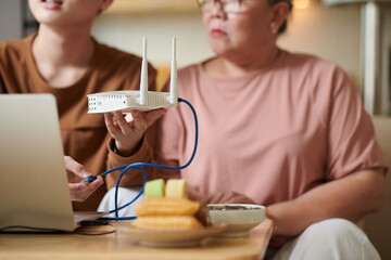 Grandson Setting up Wi-Fi Router