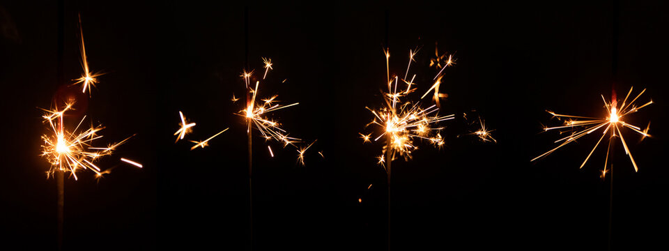 Set of sparkler with sparks with lens glare on black background for overlay blending mode for holiday design projects.