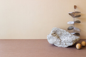 A stone podium on a beige background. Presentation of cosmetics. Mockup. Copy space.
