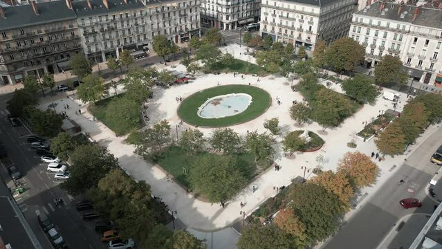 Pull back aerial shot of Place Victor Hugo in Grenoble France