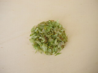 Dried hop flowers on a wooden board