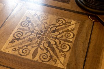 Vintage wooden parquet with floral inlay  pattern