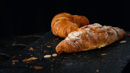 Fresh croissant on a slate stone