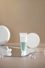 Packaging from a cream or cosmetic standing on a mirror