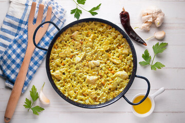 Paella with vegetables and chicken. Typical Spanish tapas recipe.