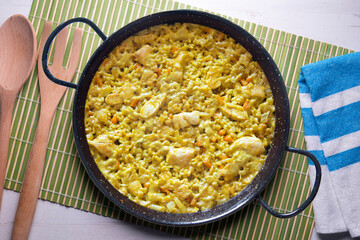 Paella with vegetables and chicken. Typical Spanish tapas recipe.