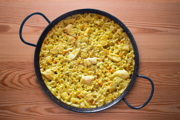Paella with vegetables and chicken. Typical Spanish tapas recipe.