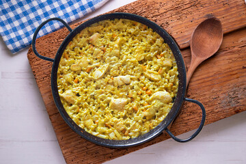 Paella with vegetables and chicken. Typical Spanish tapas recipe.