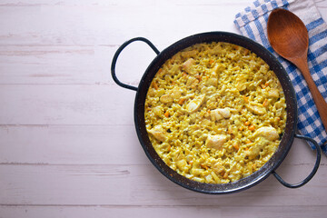 Paella with vegetables and chicken. Typical Spanish tapas recipe.