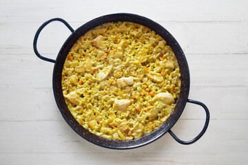 Paella with vegetables and chicken. Typical Spanish tapas recipe.