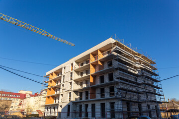 Insulation of the exterior walls of a building under construction.