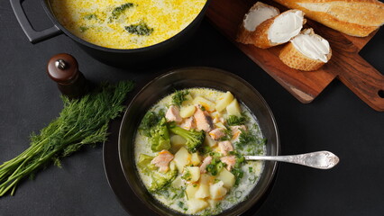 Creamy fish soup with salmon, potatoes, onions , carrots, dill and broccoli. Kalakeitto-...