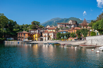 Fototapeta na wymiar View over Lake Mergozzo to the village of Mergozzo. Province of Piedmont in Northern Italy.