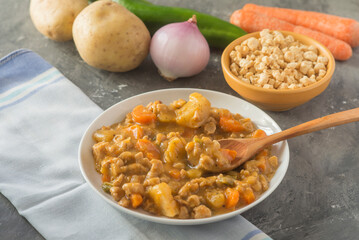 Soyabean and vegetables stew white plate