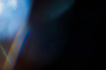 Blur colorful rainbow crystal light leaks on black background. Defocused abstract multicolored retro film lens flare bokeh analog photo overlay or screen filter effect. Glow Vintage prism colors