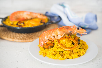 Paella typical spanish food in granite background