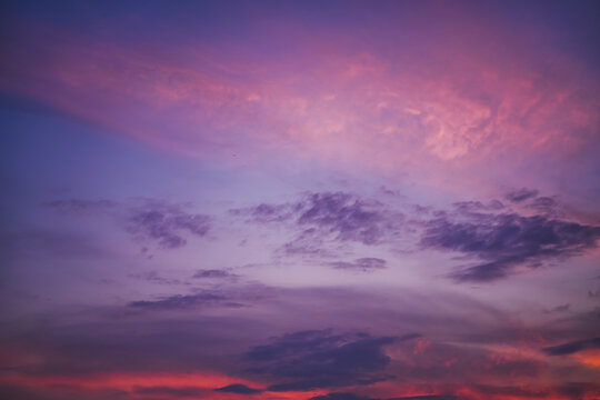 Bright sunset sky background, pink and blue tones