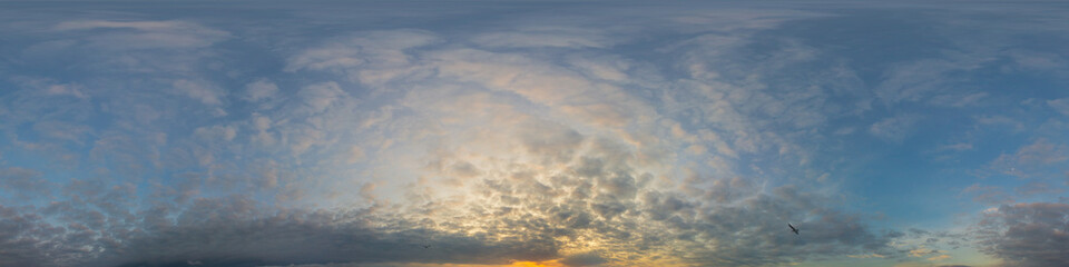 Panorama of a dark blue sunset sky with golden Cumulus clouds. Seamless hdr 360 panorama in spherical equiangular format. Full zenith for 3D visualization, sky replacement for aerial drone panoramas.