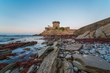 Fort de Socoa at sunset, with unique flysch landform in Ciboure and Saint-Jean-de-Luz