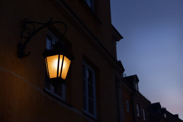 Night lamp on a brick wall
