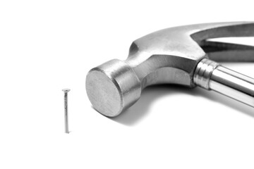 Steel hammer and nail isolated on white background. Hand working tool.